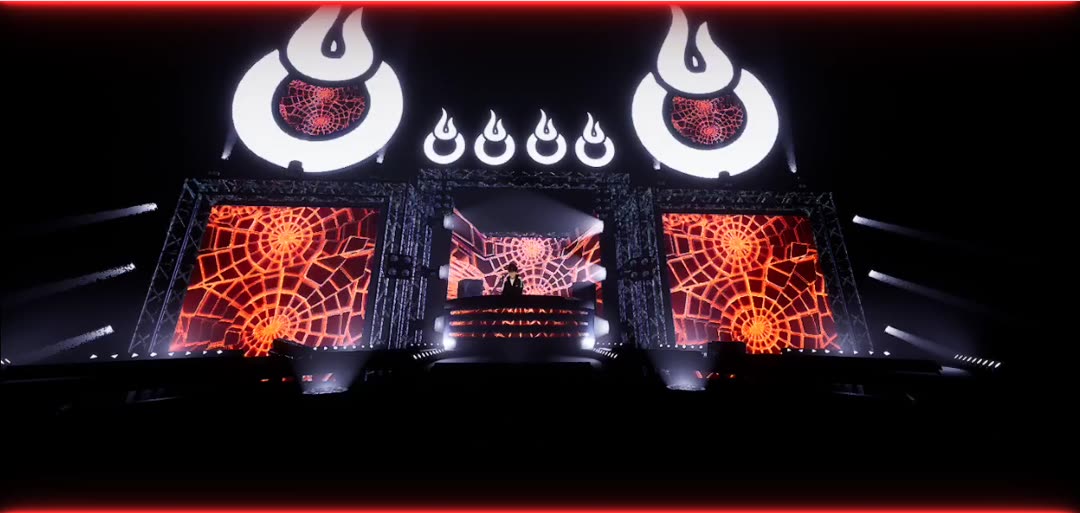 Wide frame from the BOMBTRAXX Twitch virtual stage with large logo lights and orange screen panels.